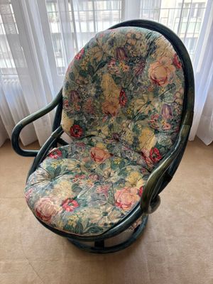 a chair that is sitting in front of a window