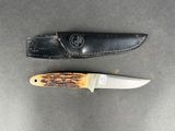 two knives that are laying next to each other on a table