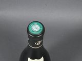a bottle of wine that is sitting on a table