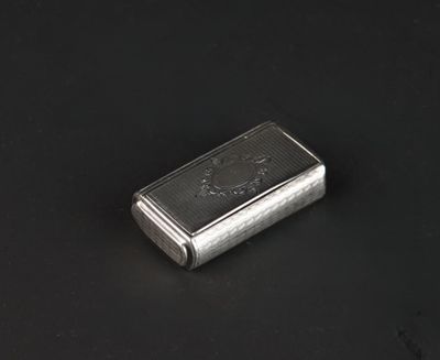 an image of a silver cigarette case on a black surface