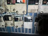 a lot of towels hanging on the wall in the bathroom