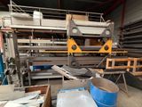 a picture of a machine that is working on a piece of metal