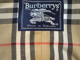 a close up of a burberry ' s shirt with a blue label on it