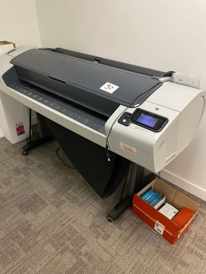 an image of a printer sitting on a desk in a room