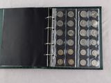 a picture of a book with a bunch of coins inside of it