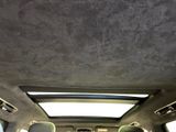 the interior of a car with the sunroof down and the back seats down