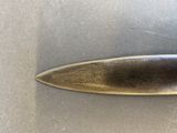 a close up of a knife on a table