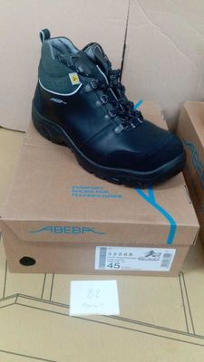 a box with a pair of black shoes on it