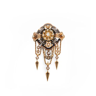 a close up of a broochle with a clock on it