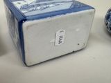 a small blue and white box sitting next to a smaller blue and white vase