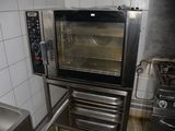 an oven that is inside of a kitchen with a sink