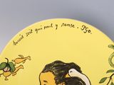 a yellow plate with a picture of a woman and a bird on it