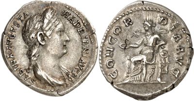 a silver coin with an image of a woman on it