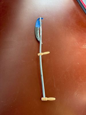 a spoon and spoon rest on a brown table