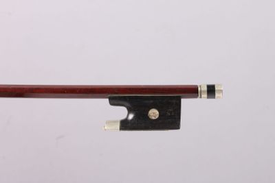 a close up of a violin bow on a white background