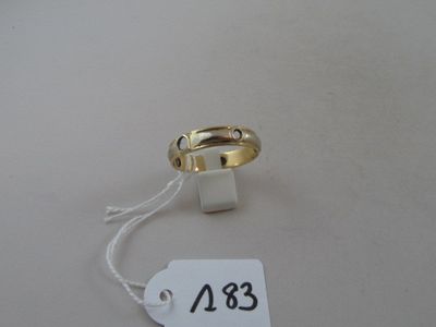 a ring with a price tag attached to it on a table
