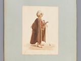 une vieille photo d'un homme en manteau et chapeau, muni d'une canne