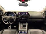 a picture of a car dashboard with a clock on it