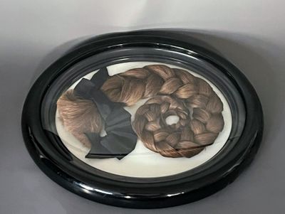 a picture of a picture of a woman ' s hair in a picture frame