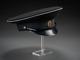 an image of a black hat on a clear stand
