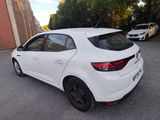 a white car parked on the side of the road