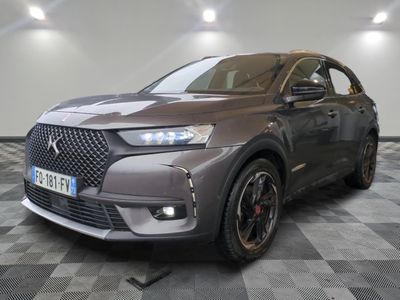the front of a grey 2021 dsx suv parked on a checkered floor
