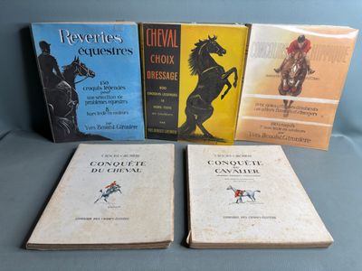 several books are sitting on a table with a blue background