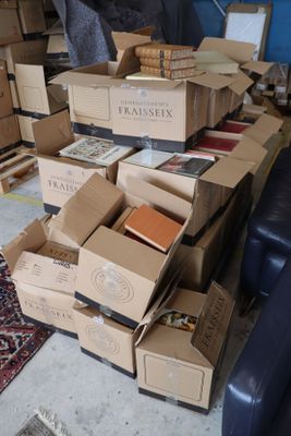 boxes of books stacked on top of each other in a living room