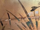 a painting of a bird on the wall of a building