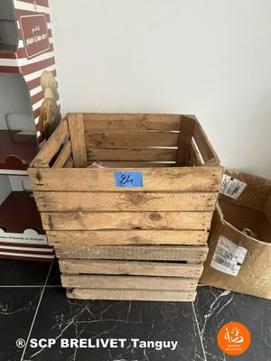 three wooden crates sitting on the floor next to each other