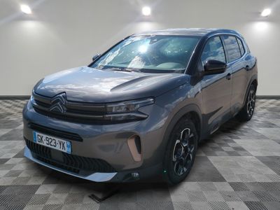 a grey toyota rav is parked on a checkered floor