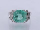 an emerald and diamond ring