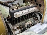 a close up of an old engine in the back of a car