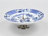a blue and white plate with a clock on it