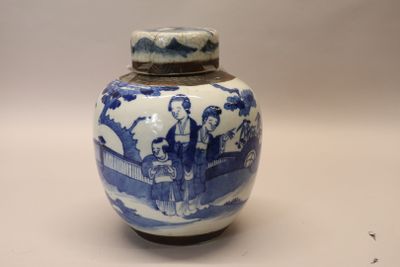 a blue and white vase with a picture of people on it
