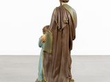 a statue of a woman holding a child in her arms