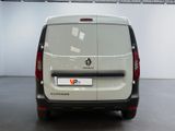 a white van parked in a room with a white wall