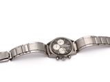an image of a close up of a wrist watch on a white surface