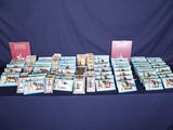 de nombreux livres posés sur une table recouverte d'une nappe bleue