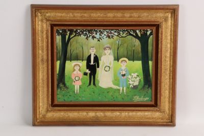 tableau encadré représentant un portrait de famille dans un parc, avec une mariée, un marié et deux enfants
