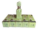 an image of a bottle of perfume sitting on top of a stack of boxes