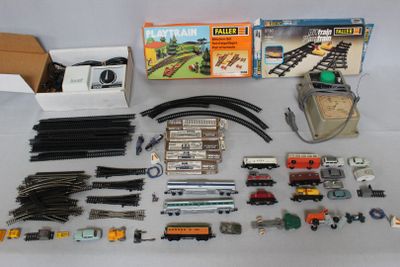 a lot of toy train tracks and accessories on the table