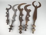 five different types of knives are displayed on a white surface