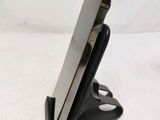 a cell phone that is on a stand on a table