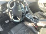 the interior of a car with black leather seats and a steering wheel