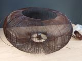 a large metal object on a wooden table
