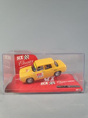 a yellow toy car in a clear box on a white surface