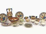 many different types of dishes and bowls on the table
