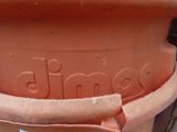a large clay pot with the word jimbo written on it