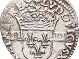 an old silver coin with a crown on top of it
